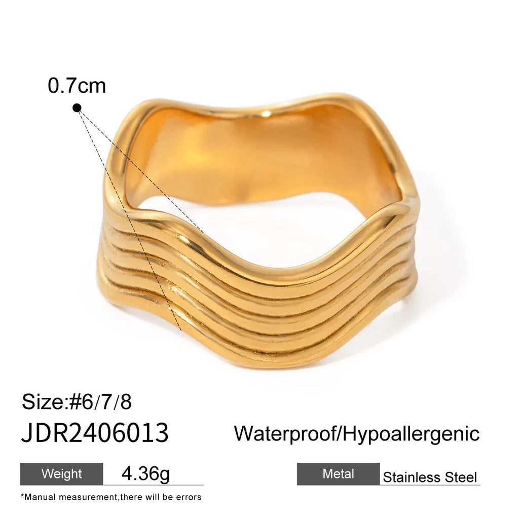 Stainless steel geometric wave ring with wide band and electroplated finish.