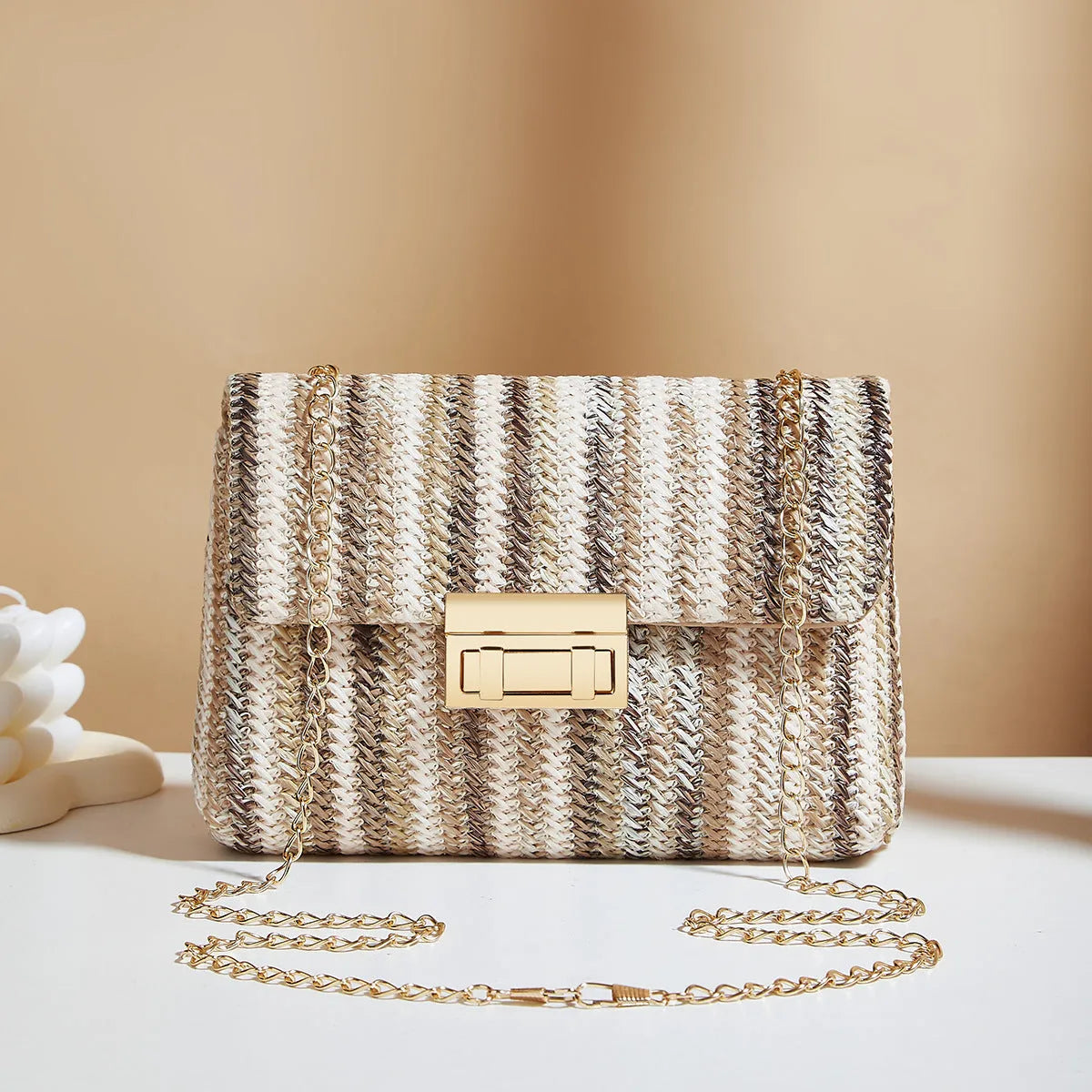 Women's straw cross-body bag with lock closure in rainbow colour option