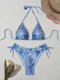 Denim blue printed bikini top and bottom set for women on a mannequin.