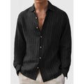 Man wearing loose fit striped polyester shirt with short sleeves in cardigan style