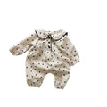 Baby onesie autumn corduroy long sleeve neutral gender beige infant bodysuit on white background