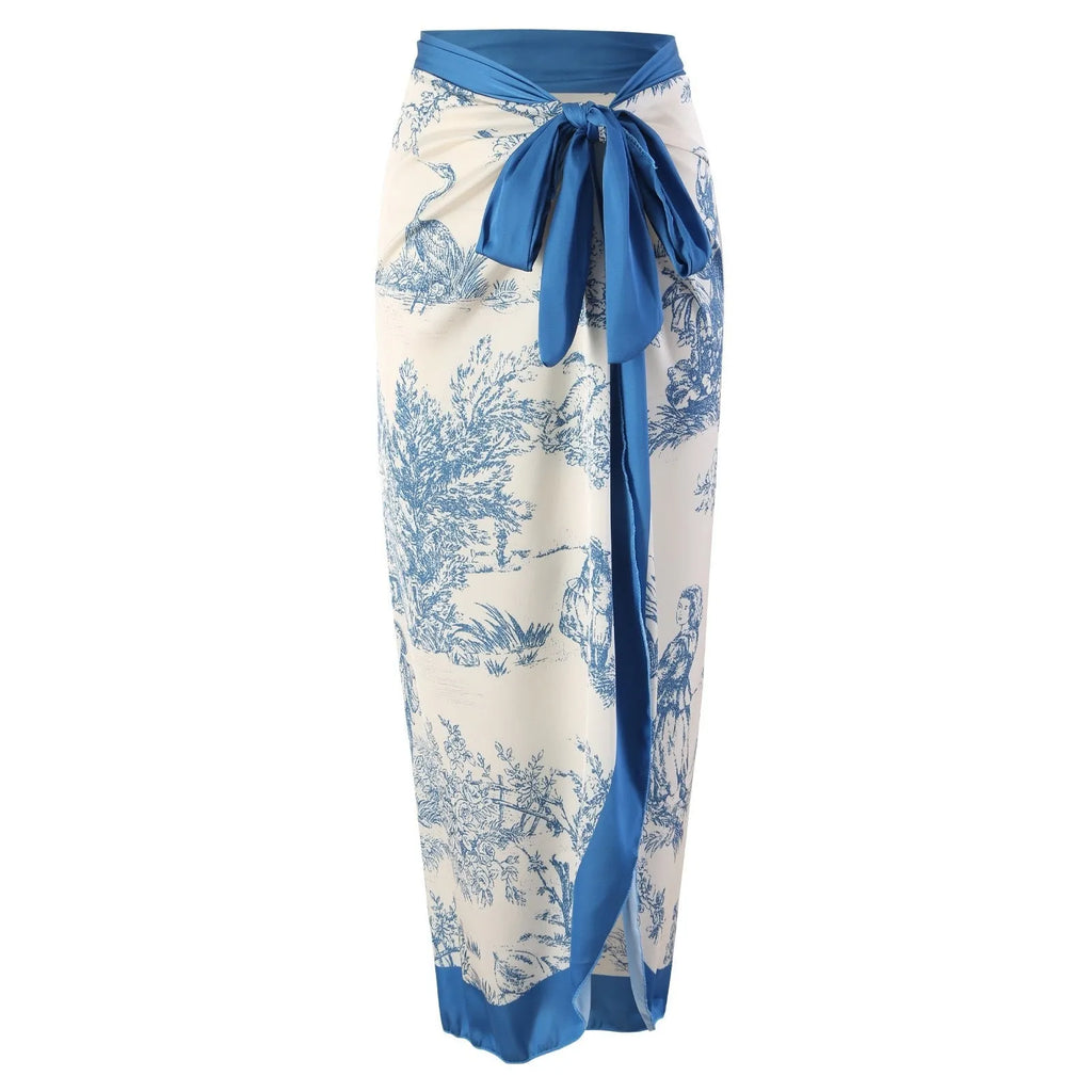 Blue women's one-piece swimsuit with a matching separate gauze skirt on a hanger.