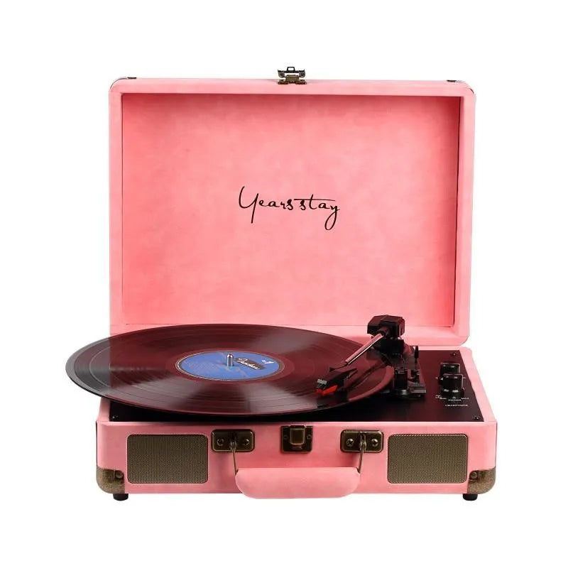 Portable Bluetooth phonograph turntable in a leather case, showing colour options.