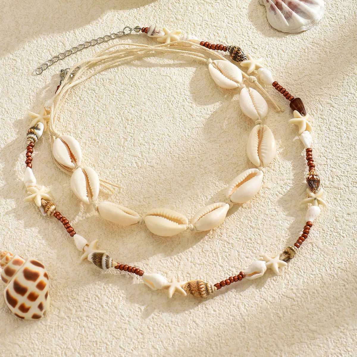 Handcrafted Bohemian shell necklace with geometric pendant on regular chain