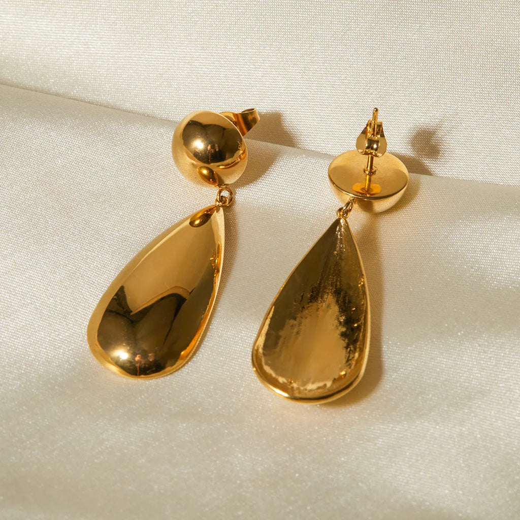 Gold-colour stainless steel pendant earrings with geometric hemisphere and water drop design.