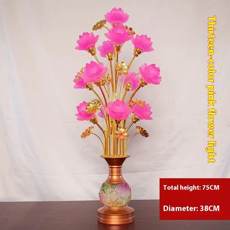 Coloured glaze pink and yellow LED lotus lantern for Buddha worship on an alloy stand.