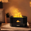 Square white flame humidifier on a desk showing a colourful 3D flame projection and a crystal salt stone.