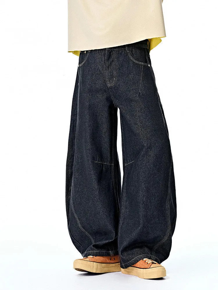 Men's wide leg denim trousers in original cow colour showing mid waist design and relaxed fit