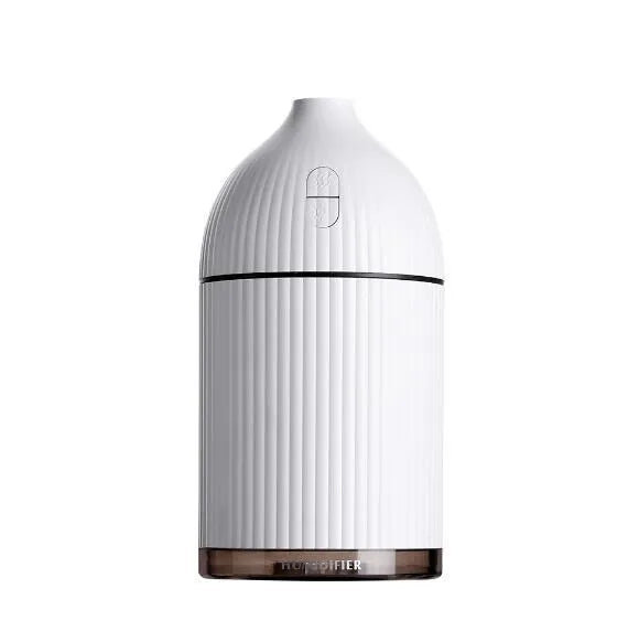 White USB-powered ultrasonic aromatherapy diffuser and humidifier with LED light on a wooden surface.