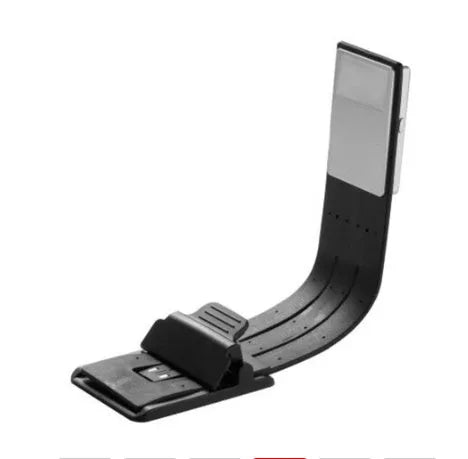 Black folding LED reading lamp showing compact folded design with USB charging port