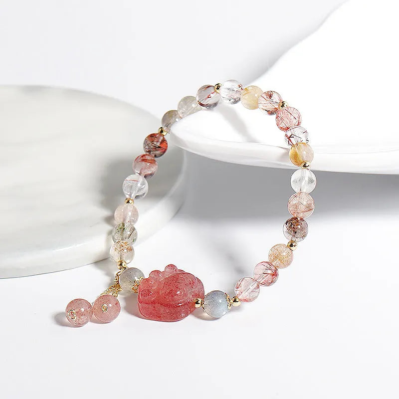 Women's handmade crystal bracelet featuring natural stone with zodiac animal motifs