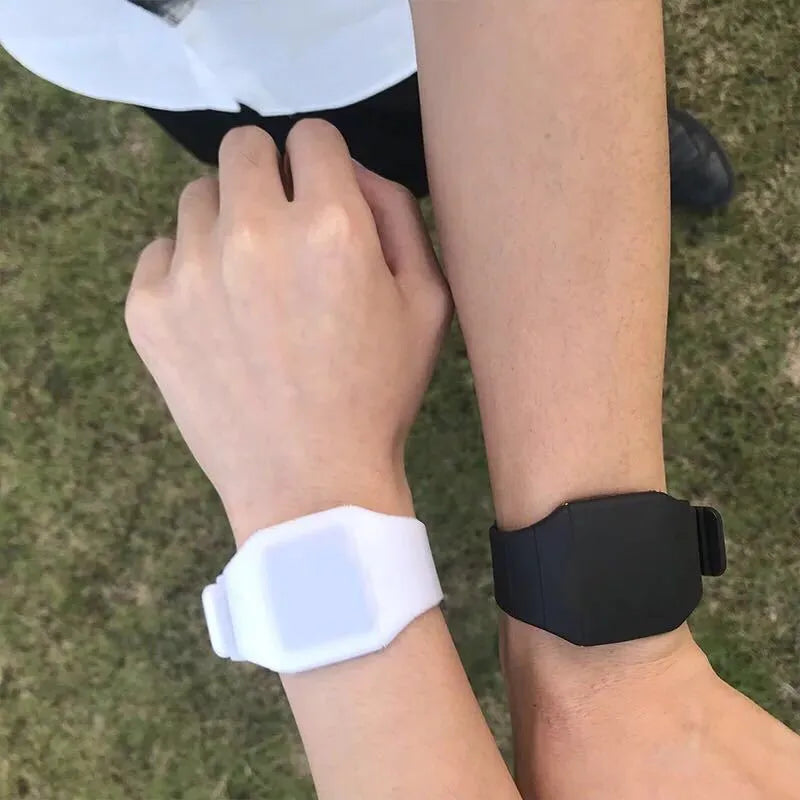 Square electronic watch with touch screen on wrist in multiple colour options
