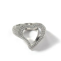 Gold copper ring with hollow heart cut-out and zircon stone on finger