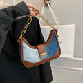Brown denim women's bucket shoulder bag with diamond mesh detail and a chain strap.