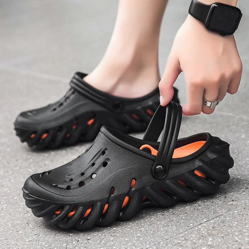 Men's beige ventilated EVA slipper sandals with hollow-out design and round toe on a plain background.