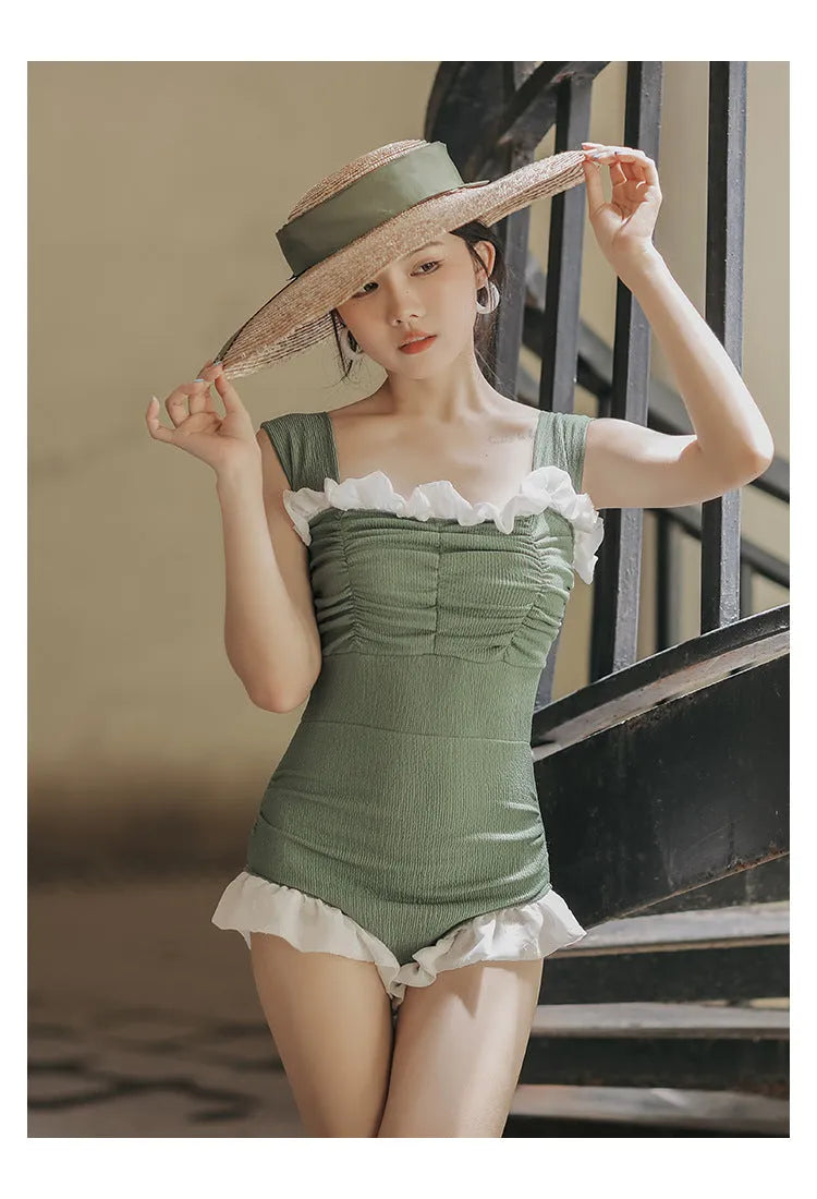 High-waisted one-piece swimsuit in quick-dry polyester fabric, shown in black.