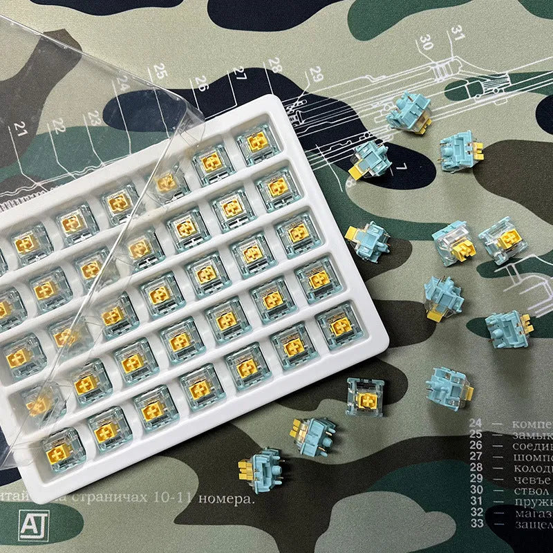 Set of 36 Sea Salt Lemon PRO Mute coloured five-pin mechanical keyboard switches.