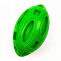 Blue, green, and orange natural rubber squeaky dog chew ball with grooved surface.