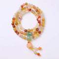 Women's Jinsi Jade bracelet with pumpkin tassel on a 14-16cm wrist.