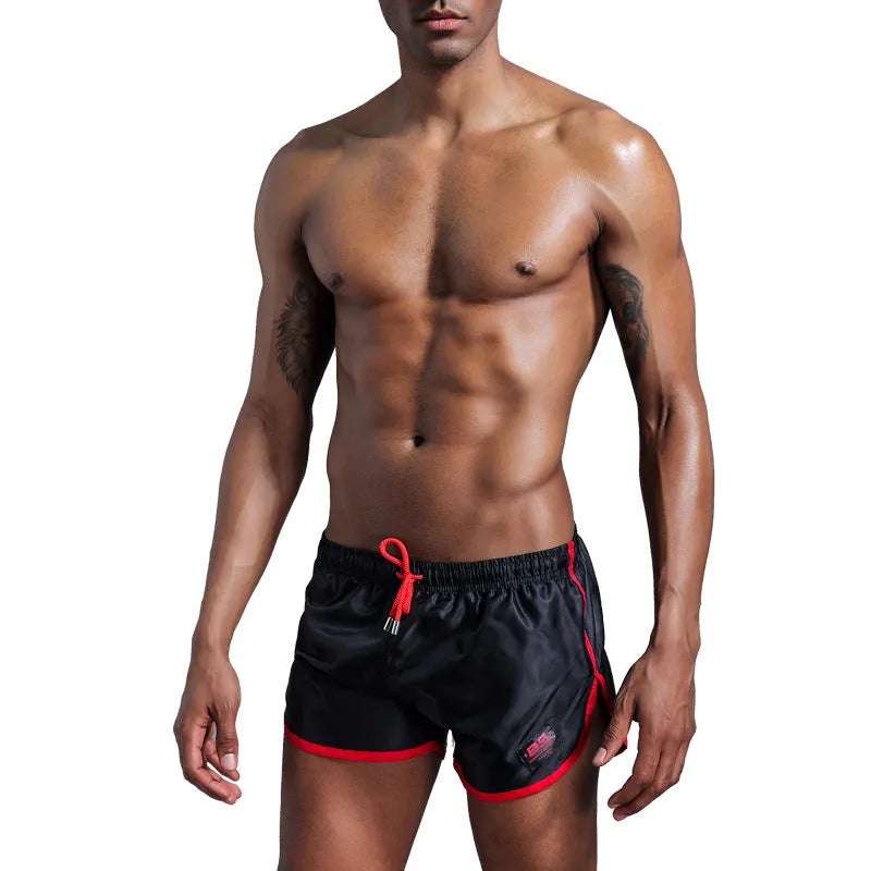 Men's solid colour polyester sports shorts in blue showing smooth beach pants design for fitness and swimming