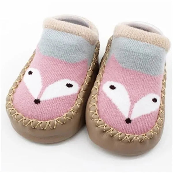 Pair of pastel coloured baby socks with anti-slip dots on the sole, shown flat.