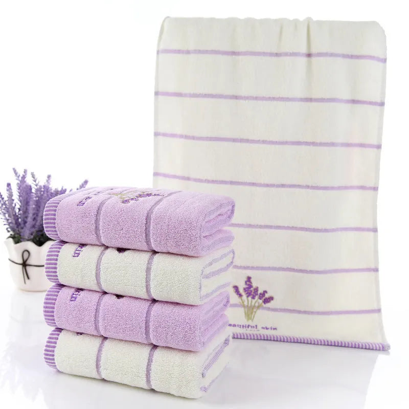 Pure cotton 32 strand embroidered face washing towel in green, 34x74cm, folded on a surface