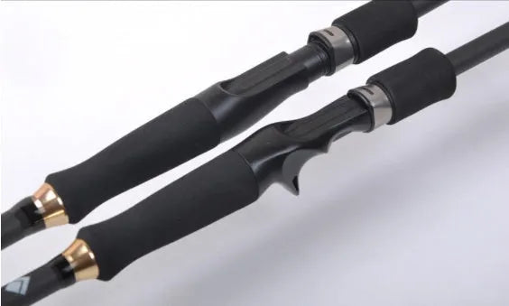Telescopic carbon fishing rod with matte coating and reel seat on a lakeside bank