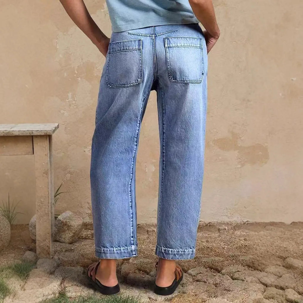 Casual loose jeans trousers in light blue denim with washed finish