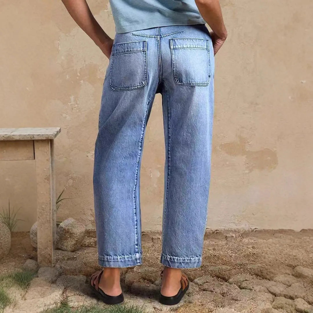 Casual loose jeans trousers in light blue denim with washed finish