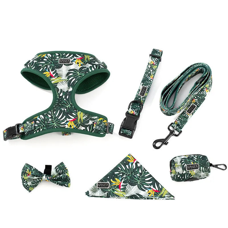 Six-piece adjustable dog harness set with leash, collar, waste bag, bow, and scarf on a blue background.