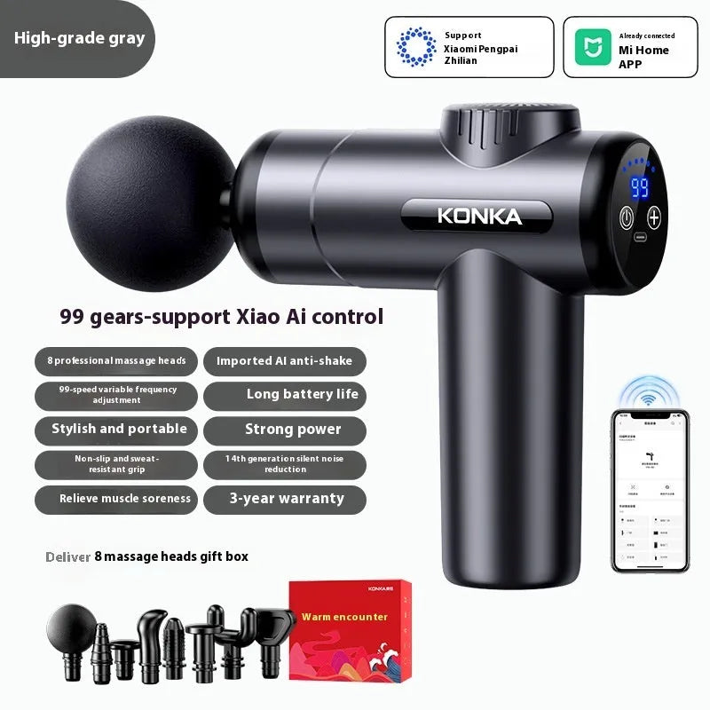 Konka V19 grey professional electric massage gun with multiple silicone attachment heads on a table.