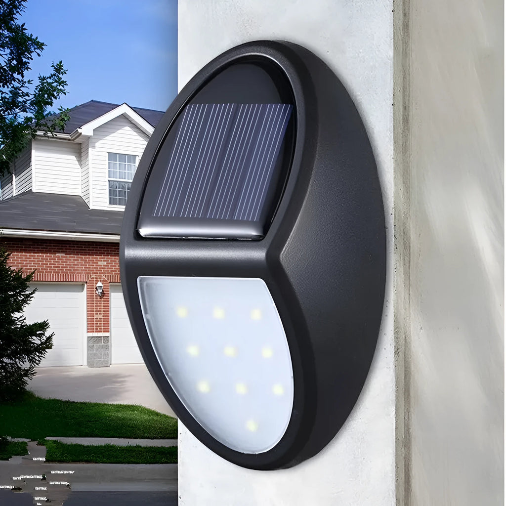 Black rectangular solar-powered LED wall light for outdoor garden use.