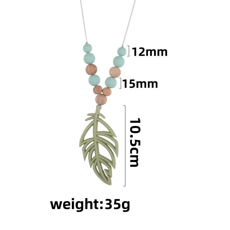 Baby silicone leaf teether necklace in mint green on a light background, BPA-free, 35g, for 3+ months