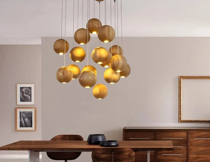 Nordic-style solid wood ball chandelier pendant light with adjustable cord, shown with a wooden disc base.