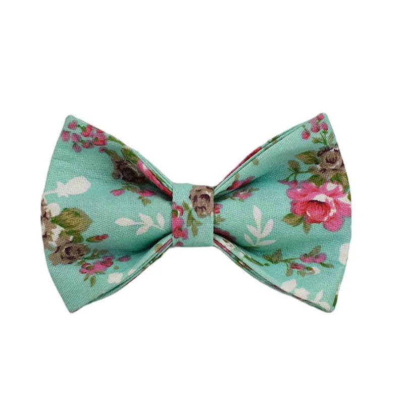 Rose pattern fabric dog collar set with green background, matching leash, detachable bow and coordinating dog vest