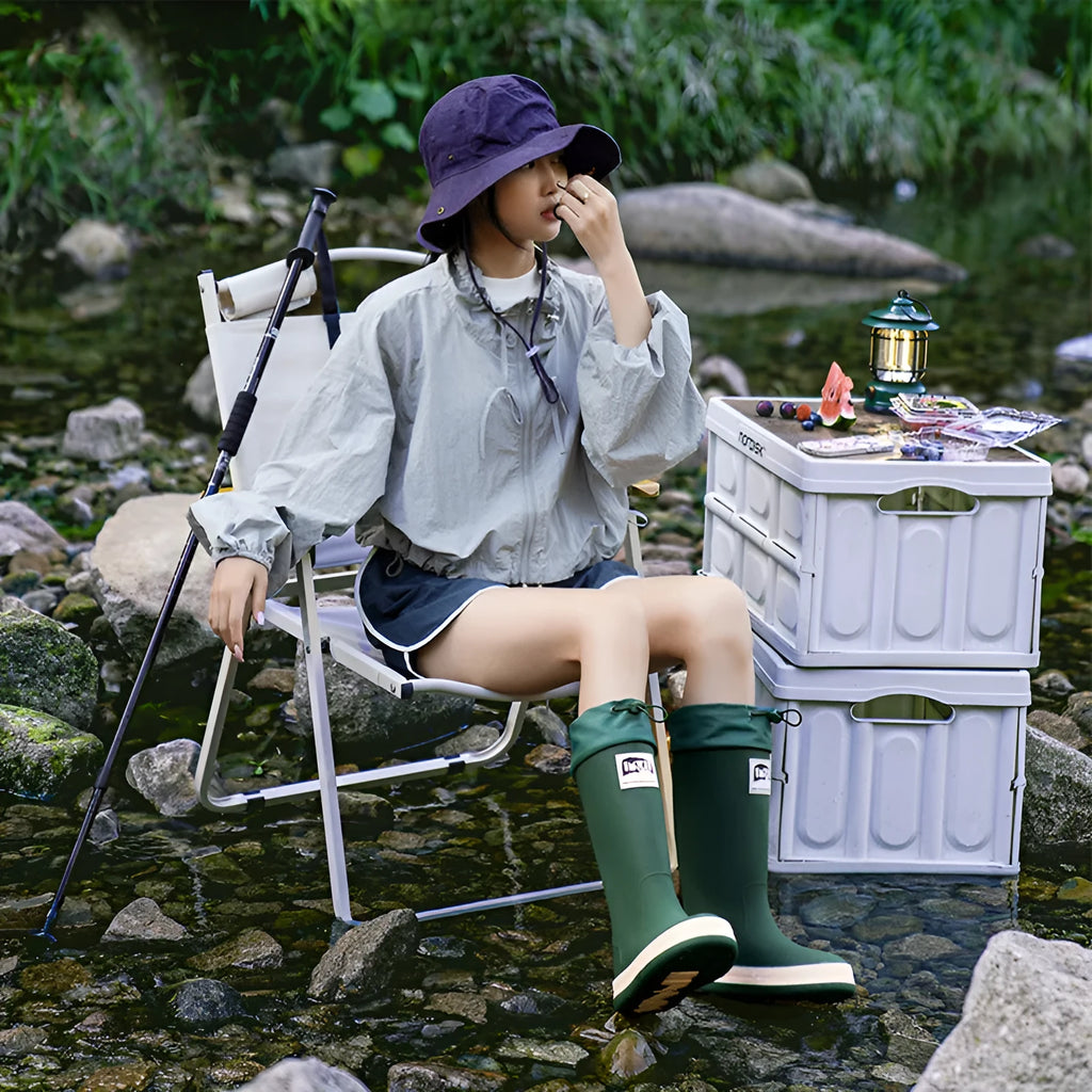 Solid colour high tube PVC rain boot in beige, shown on a white background.