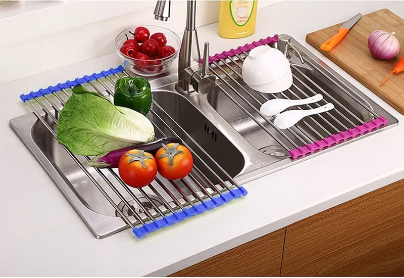 Folding stainless steel kitchen sink drying rack with multiple tubes, shown in a red finish.
