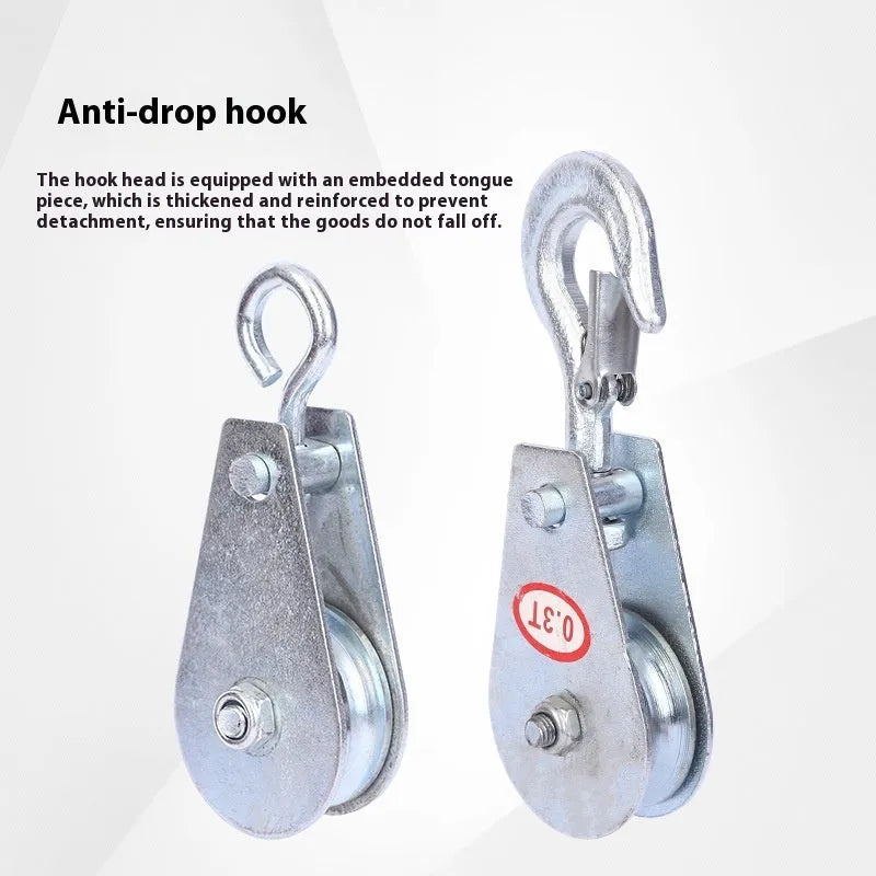 Red industrial single sheave lifting pulley with a safety latch on the steel hook.