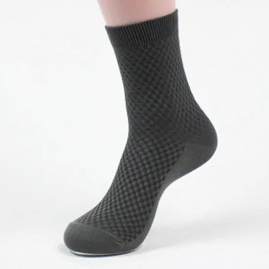 Men's bamboo fibre ankle socks in black, navy, silver grey, iron grey, and grey blue with a small square pattern.