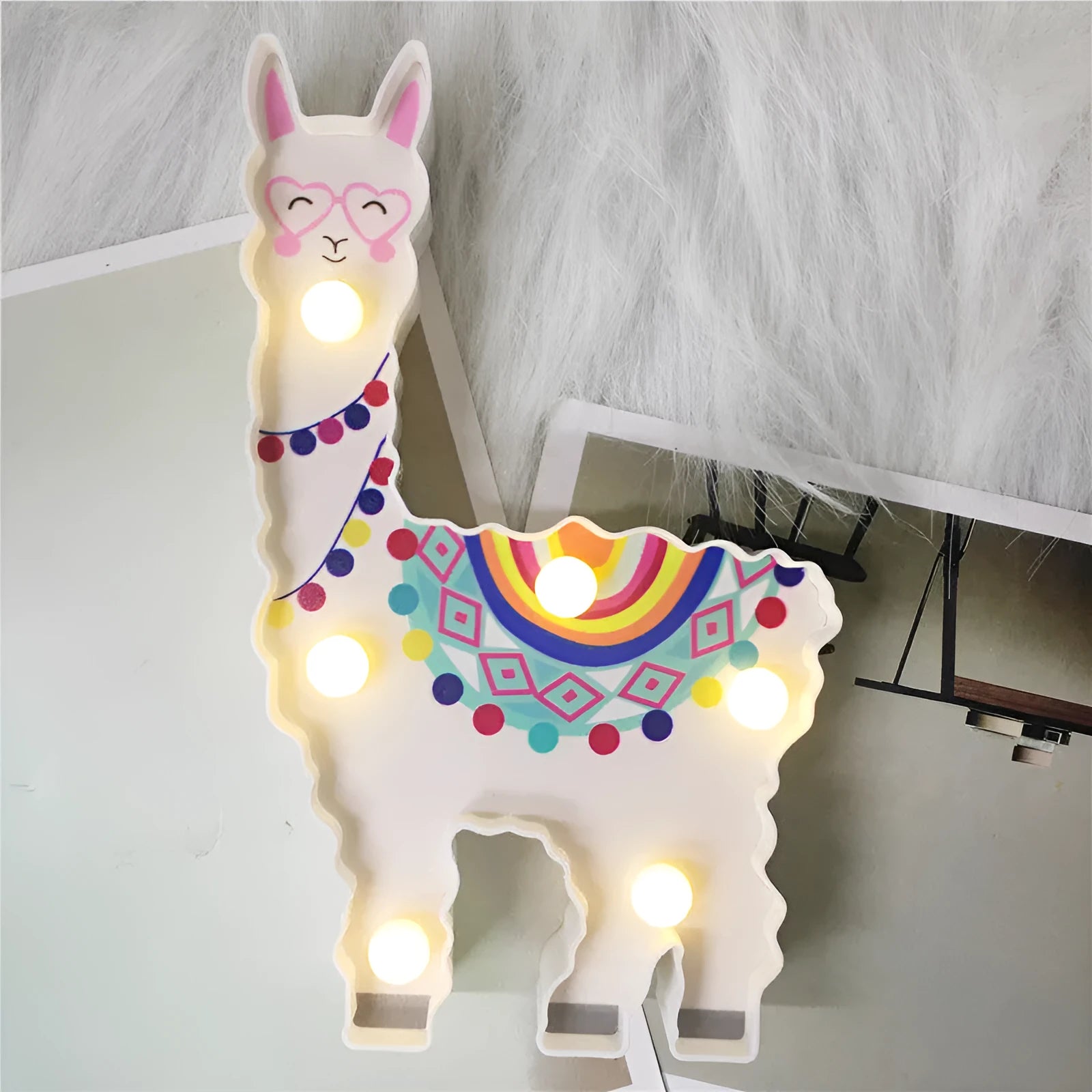 Alpaca night light 19cm tall in white colour on bedside table
