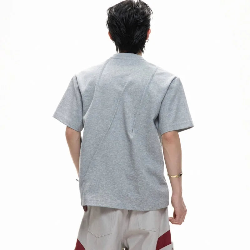 Men's loose fit cotton T-shirt with pleated detail and round neck in grey.