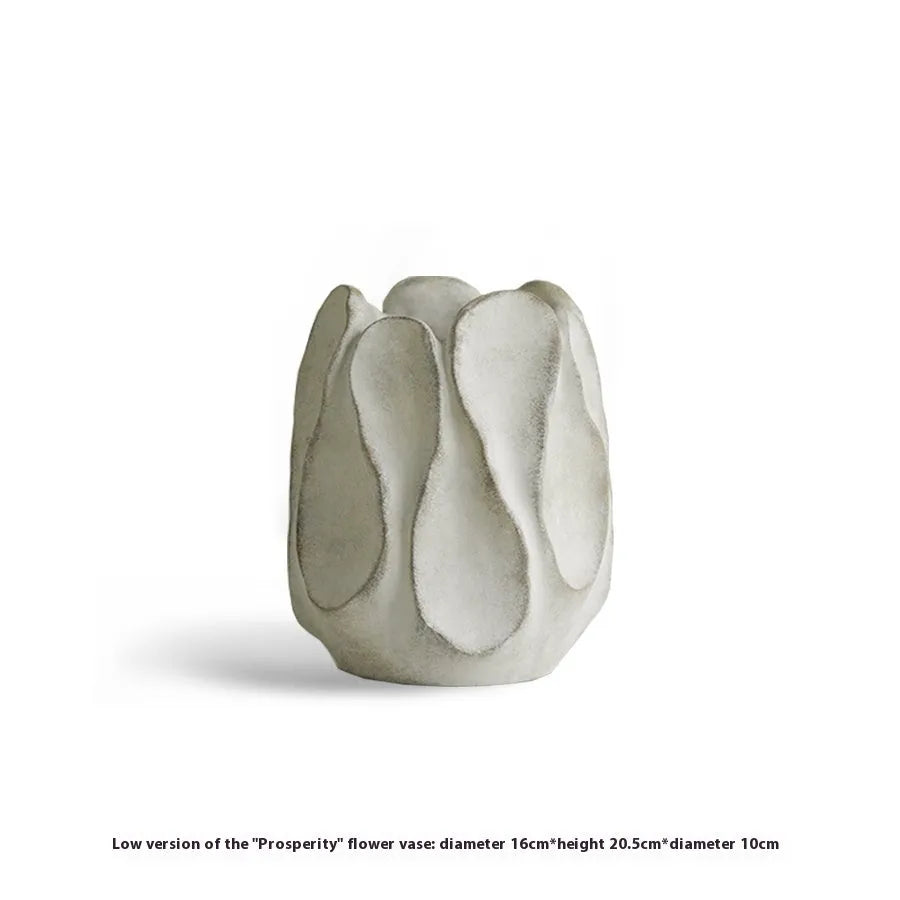 Irregular ceramic vase with resin flower device accents in magnesium clay material