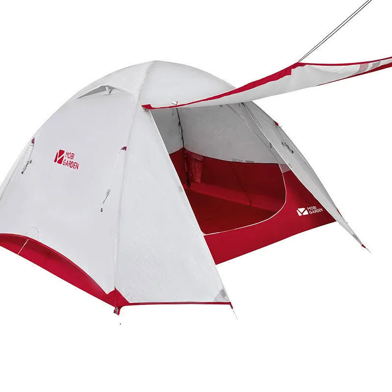 Double deck aluminum alloy camping tent in green, pitched outdoors with flysheet and aluminium poles visible
