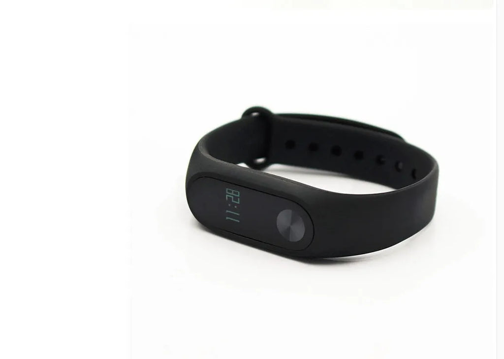 Black Xiaomi Mi Band 2 smartband with OLED display on a thermoplastic wrist strap.