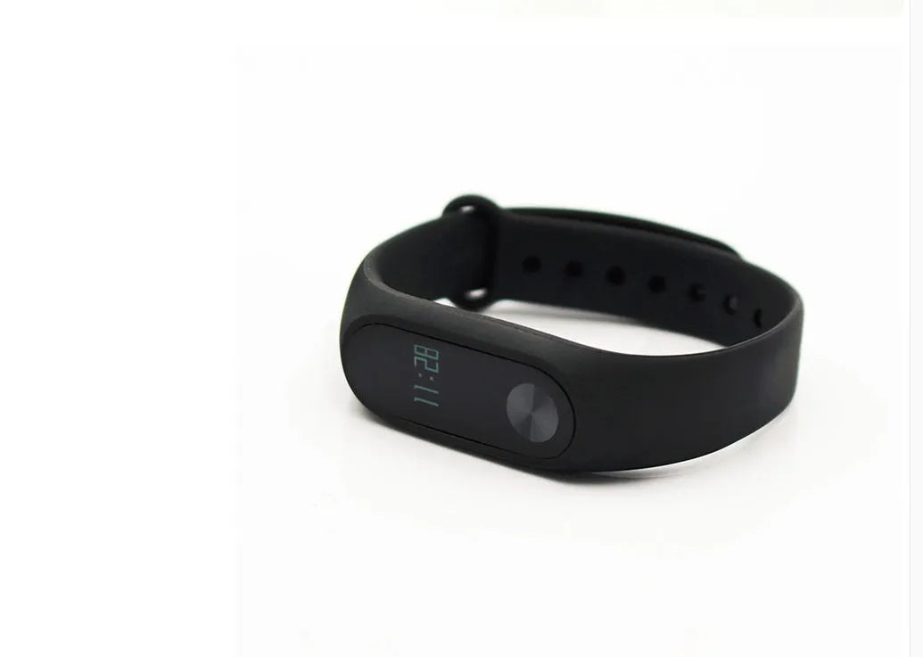 Black Xiaomi Mi Band 2 smartband with OLED display on a thermoplastic wrist strap.