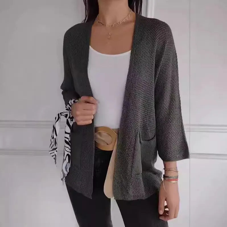Women's waffle-textured cardigan coat in army green with nine-quarter sleeves and front pockets.