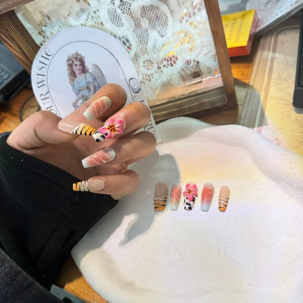 Zebra pattern lily hand carving nail art set showing embossed flower and leopard print designs