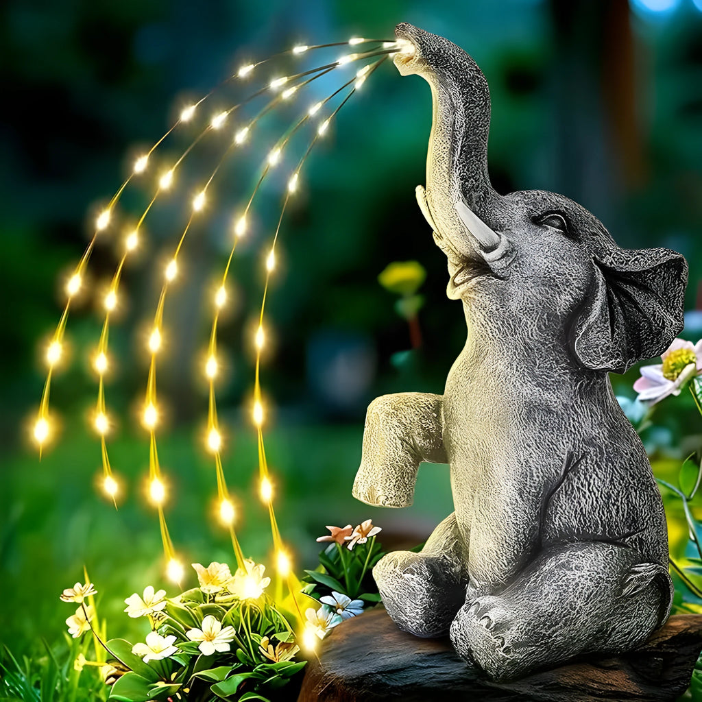 Resin elephant garden statue with integrated light strip for outdoor decoration.