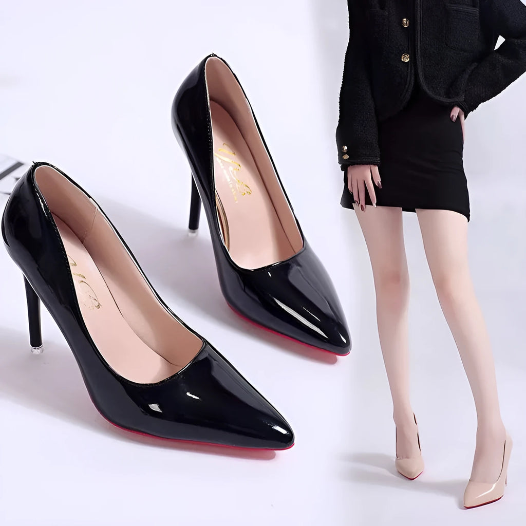 Women's black stiletto heel pump with pointed toe and shallow mouth cut on a white background.