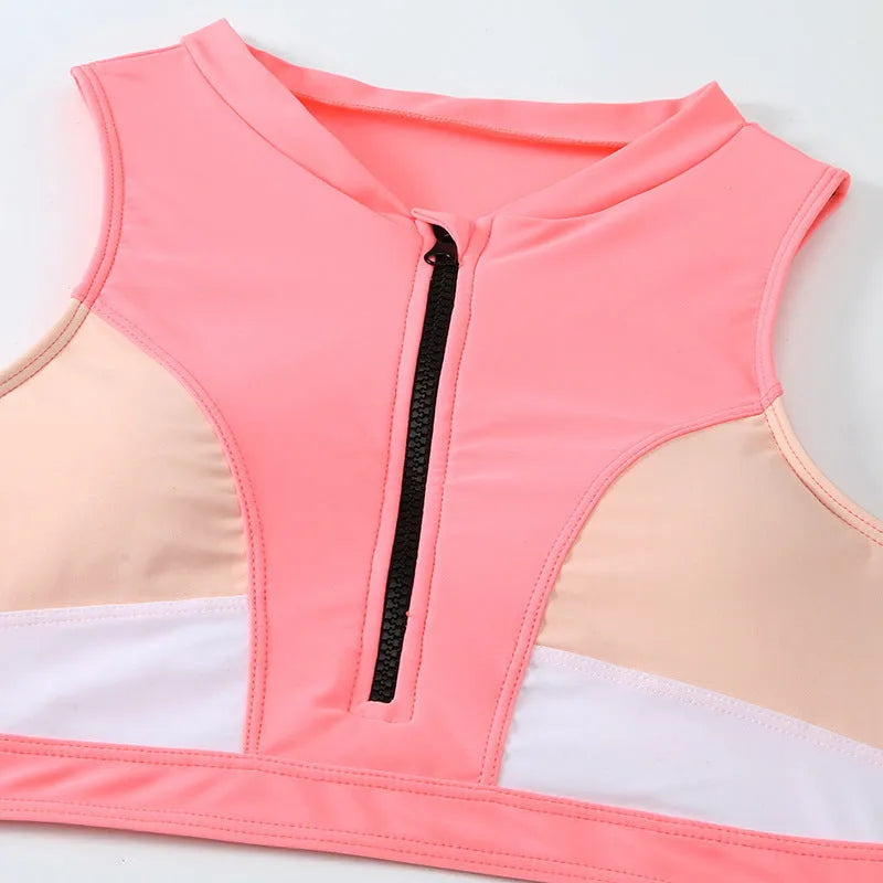 Pink high-waist bikini swimsuit set with brief bottoms and a matching bra on a mannequin.